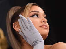 Ariana Grande gets emotional as she admits to ‘hiding’ behind lip filler and Botox