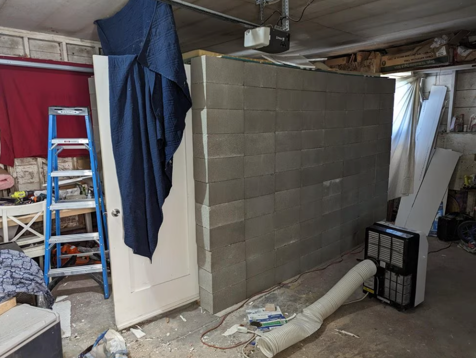 The makeshift cell constructed using cinderblocks in the garage in the home in Klamath Falls