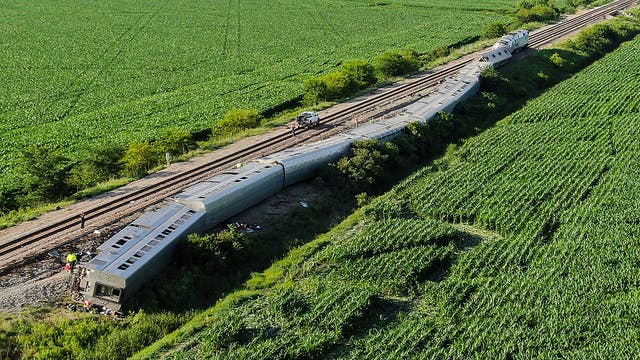 <p>An Amtrak train lies derailed after the train hit a truck at a crossing, June 27, 2022, near Mendon, Mo</p>