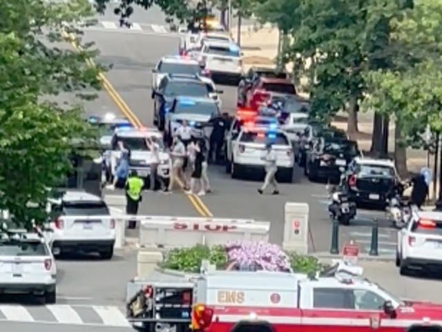 <p>People being led out of Russell Senate Office Building following a 911 call and massive emergency response</p>