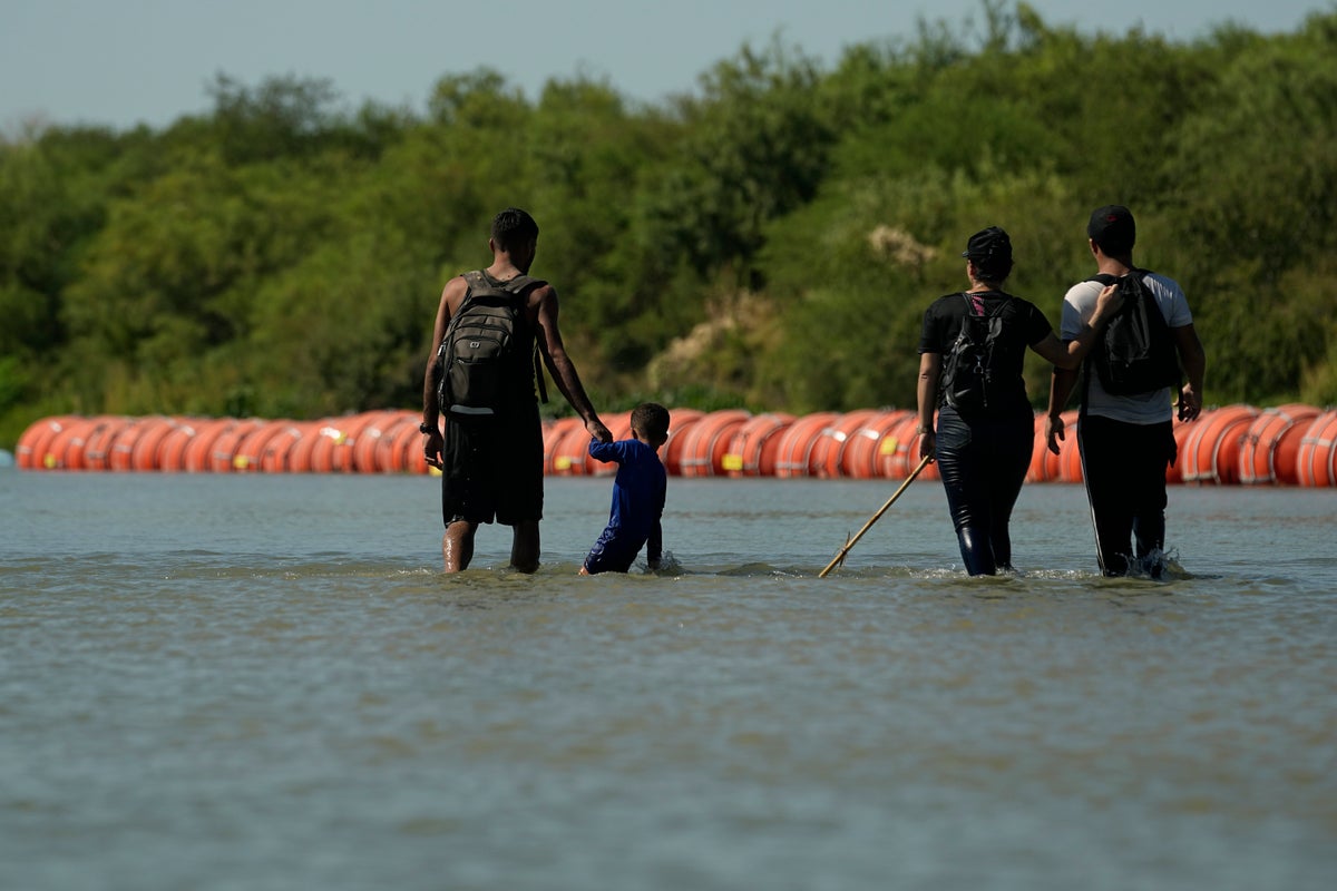 Mexico says the first body has been spotted near a floating barrier in the Rio Grande river
