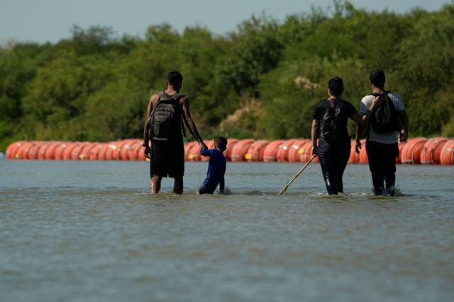 <p>Migrants cross the Rio Grande at Eagle Pass, Texas </p>