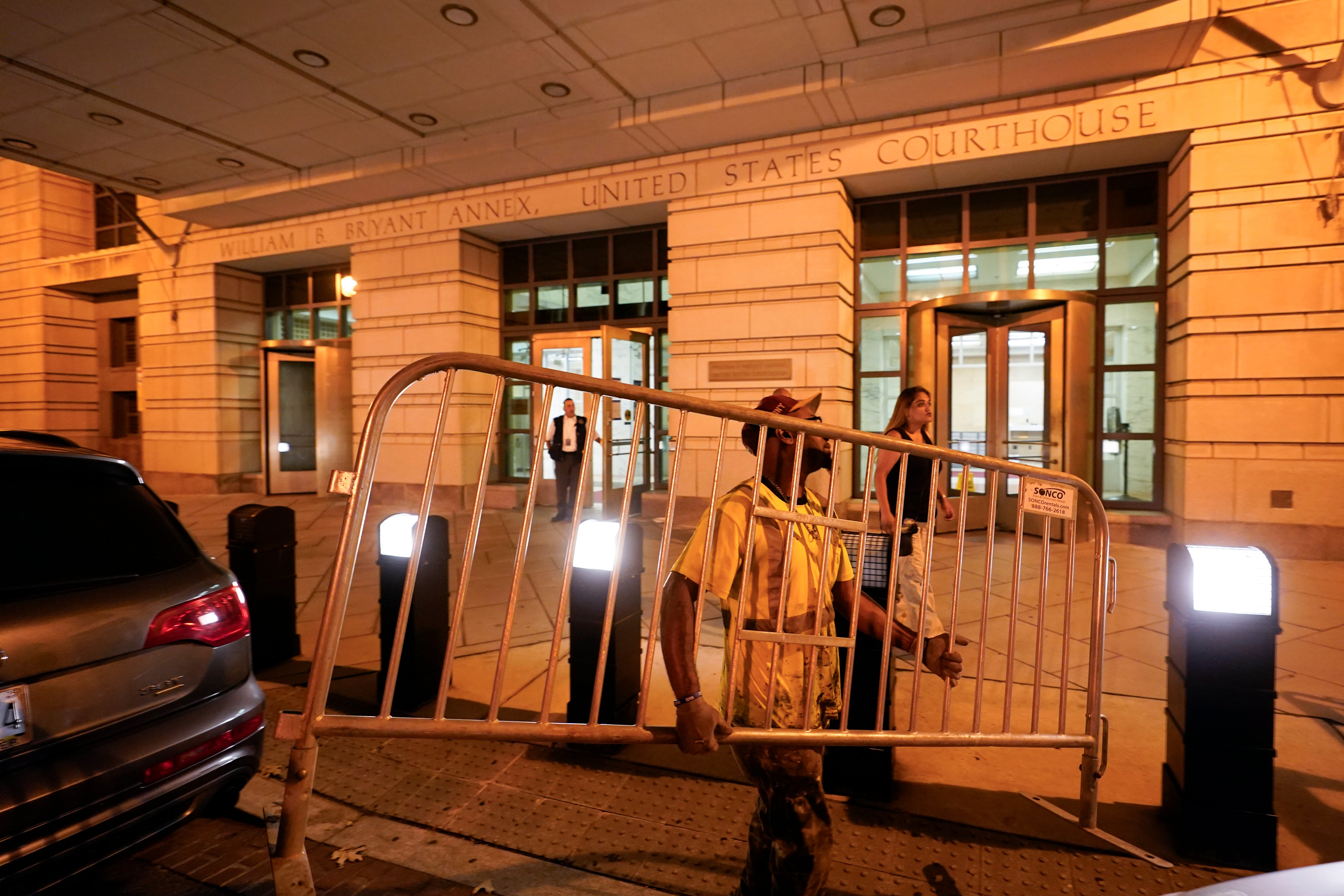 Workers put up barricades outside the E. Barrett Prettyman U.S. Federal Courthouse on Wednesday