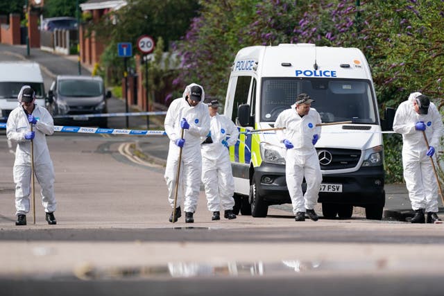 <p>Forensic officers at the scene on Freeth Street in Ladywood, Birmingham where a woman was found seriously injured and later died at the scene.</p>