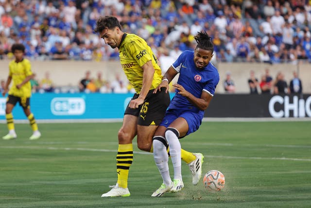 <p>Christopher Nkunku in action for Chelsea against Borussia Dortmund</p>