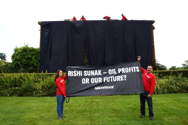<p>Greenpeace activists climbing at the home of Prime Minister Rishi Sunak</p>