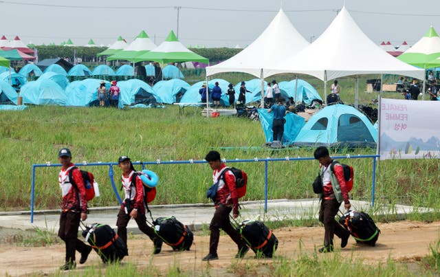 <p>Participants for the 25th World Scout Jamboree arrive at a camping site in Buan</p>