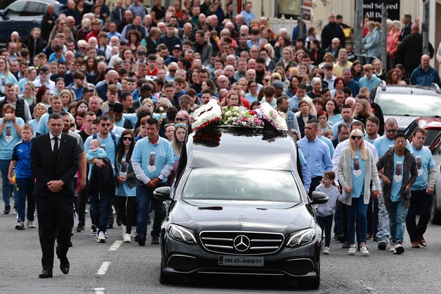 <p>Huge crowds turn out for the funeral procession of Kiea McCann as it makes its way to the Sacred Heart Chapel in Clones, Co. Monaghan for her funeral </p>