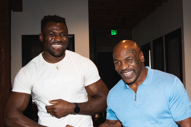 <p>Francis Ngannou, left, with former world heavyweight champion Mike Tyson</p>