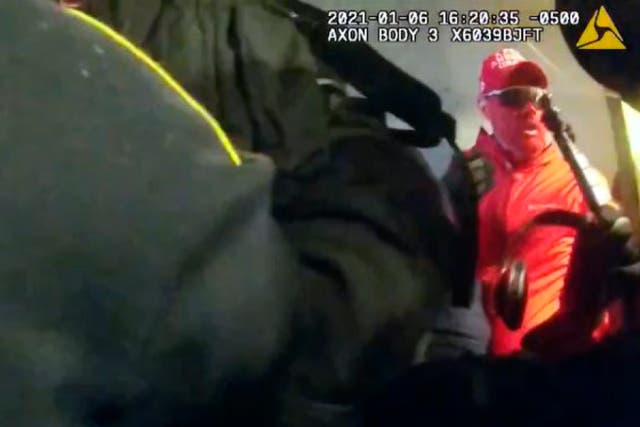 <p>This image from video contained in the statement of facts supporting the arrest warrant for Daniel Donnelly Jr., shows Donnelly at an entrance to the U.S. Capitol during the Jan. 6, 2021, riot. The face-painting St. Louis Cardinals fan known as "Rally Runner" has been arrested on charges that he joined a mob's attack on the U.S. Capitol and used a stolen shield to help other rioters attack police officers. </p>