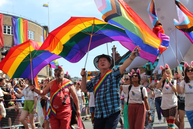 People attending last year’s Brighton Pride festival. Govia Thameslink Railway has announced that no trains will run to or from Brighton on Saturday (Maurice Bafunno/PA)