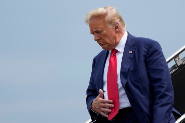 <p>Former President Donald Trump arrives at Ronald Reagan Washington National Airport for his 3 August arraignment </p>