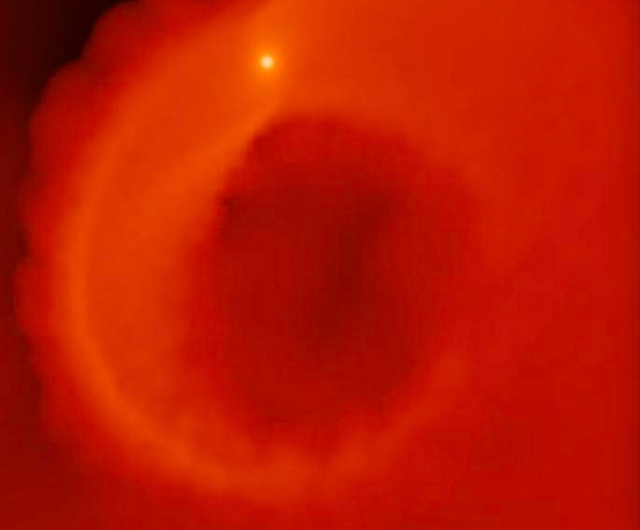 <p>A hot jupiter planet is pushed to its star too close and starts to evaporate, shedding its outer layers into the surrounding disc</p>