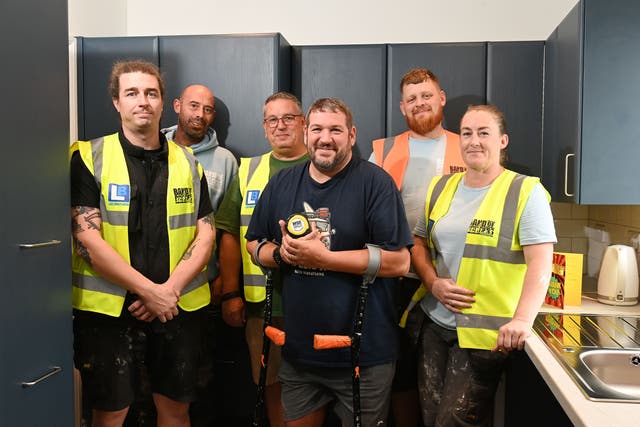Chris Chappell (centre) pictured with some of the team from the Band of Builders (Matt Gilley/FPS Images/PA)