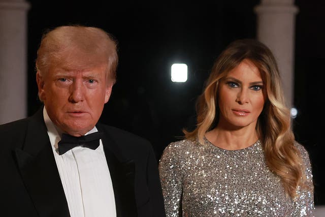 <p>Donald Trump addresses the press on New Year’s Eve 2022 with wife Melania  </p>
