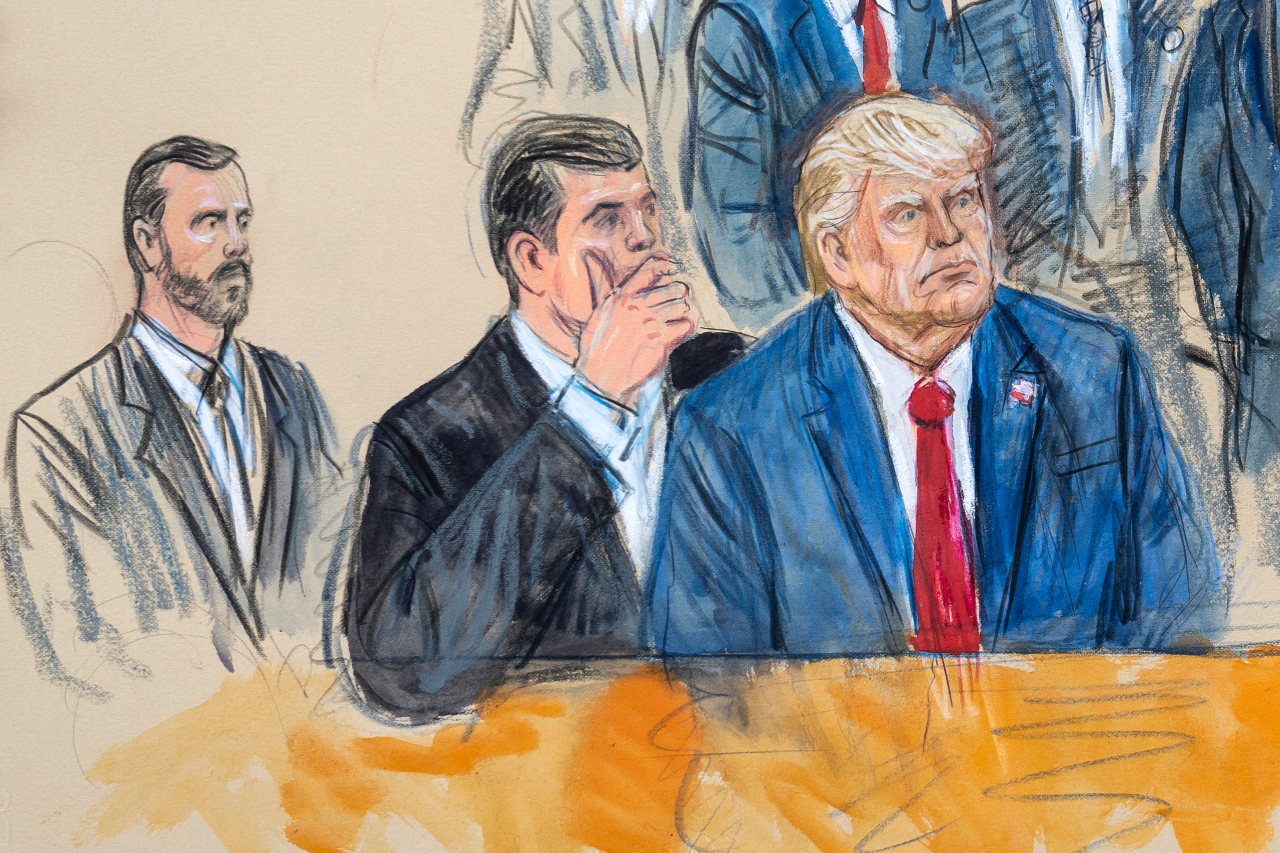 This artist sketch depicts former President Donald Trump, right, conferring with defense lawyer Todd Blanche, center, during his appearance at the Federal Courthouse in Washington, Thursday, Aug. 3, 2023.