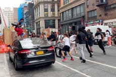 Crowd overwhelms New York City's Union Square, tosses chairs, climbs on vehicles
