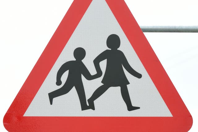 General view of a school crossing sign, London (Ian West/PA)