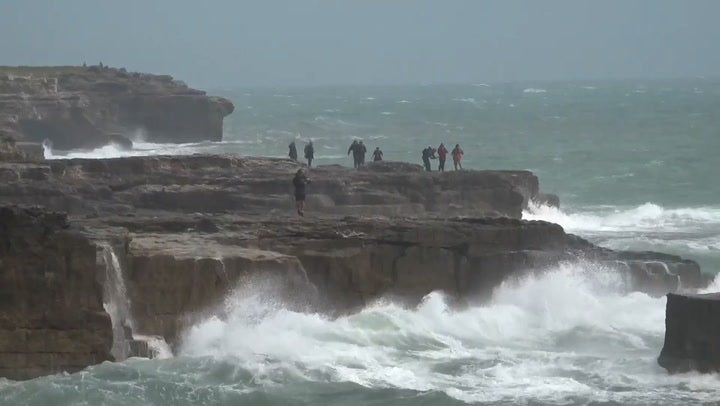 Waves crash against Dorset shore as danger to life warning issued