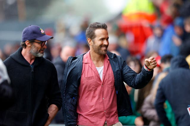 <p>Ryan Reynolds and Hugh Jackman were in attendance for Wrexham’s first League Two game of the season</p>