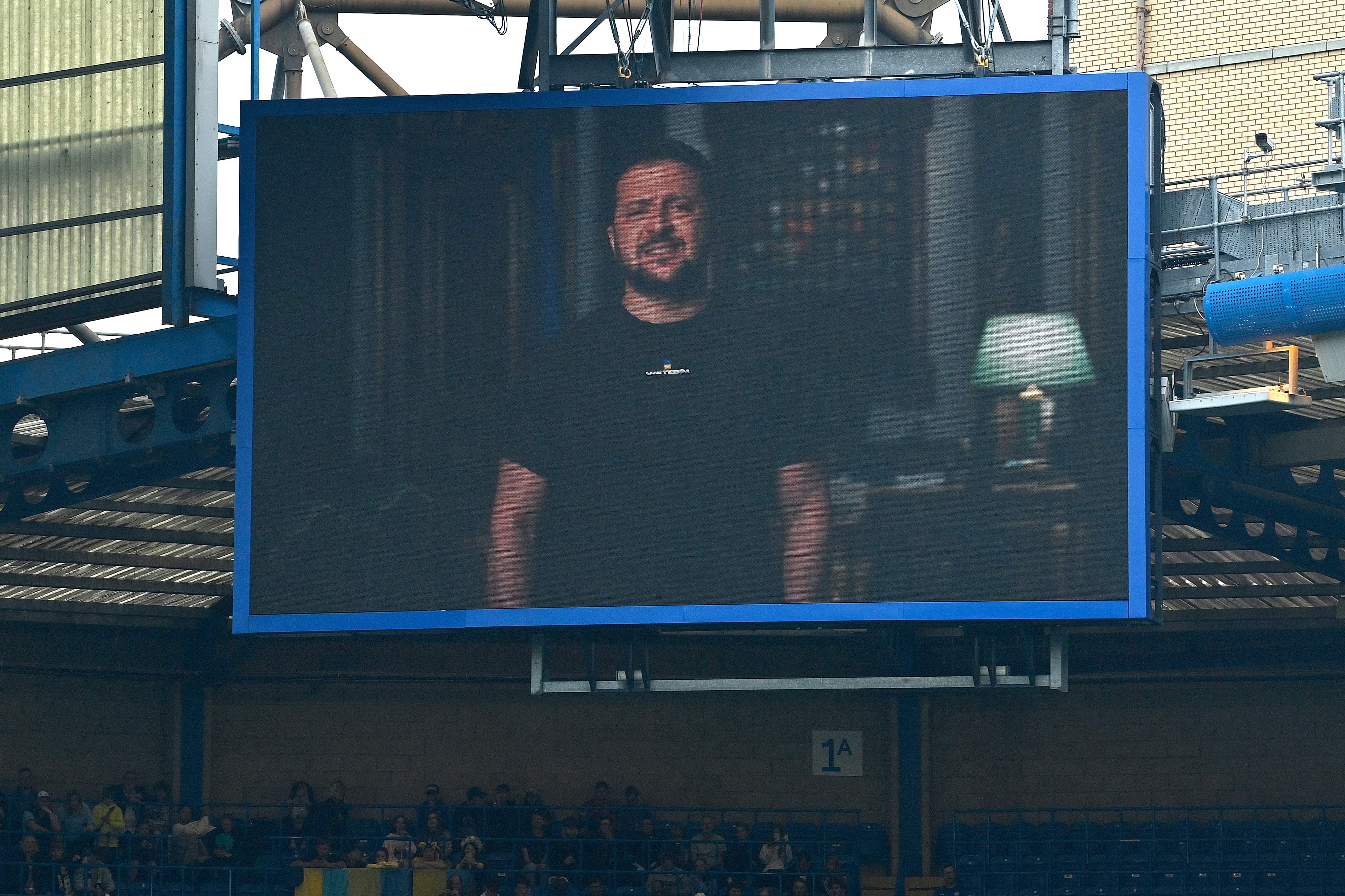 President Volodymyr Zelensky addresses the players and the crowd from a giant screen