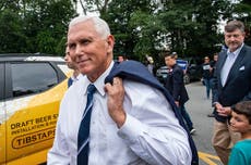 Mike Pence heckled by Trump supporters at town hall after rolling out mocking merch