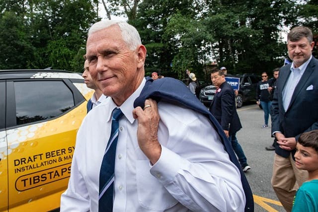 <p>Mike Pence was heckled by Trump supporters while campaigning in New Hampshire</p>