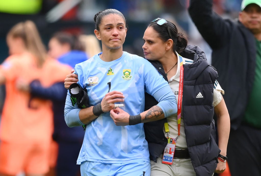 South Africa goalkeeper Swart is consoled after her error