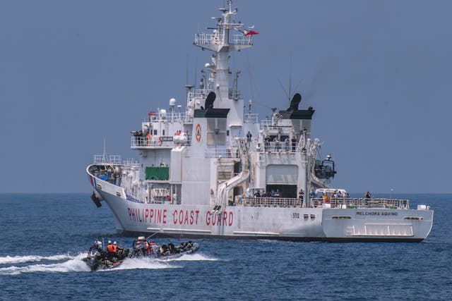 <p>File. Members of the Philippine Coast Guard take part in a simulation during a trilateral maritime exercise with Japan and USA coast guard on 6 June 2023, 15 nautical miles off the coast of Bataan province, western Philippines. The drills that took place in waters facing South China Sea included maneuverings, maritime law enforcement, and search and rescue at sea</p>