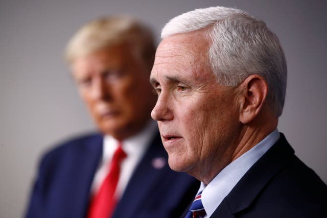 <p>Mike Pence speaks, with Donald Trump in the background </p>