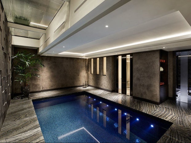 The indoor pool room is finished with Kenya Black Marble
