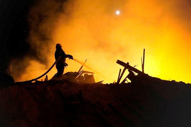 <p>A firefighter extinguishes a fire in the aftermath of an attack, amid Russia's attack on Ukraine, in the Starokostiantyniv, Khmelnytskyi Region</p>