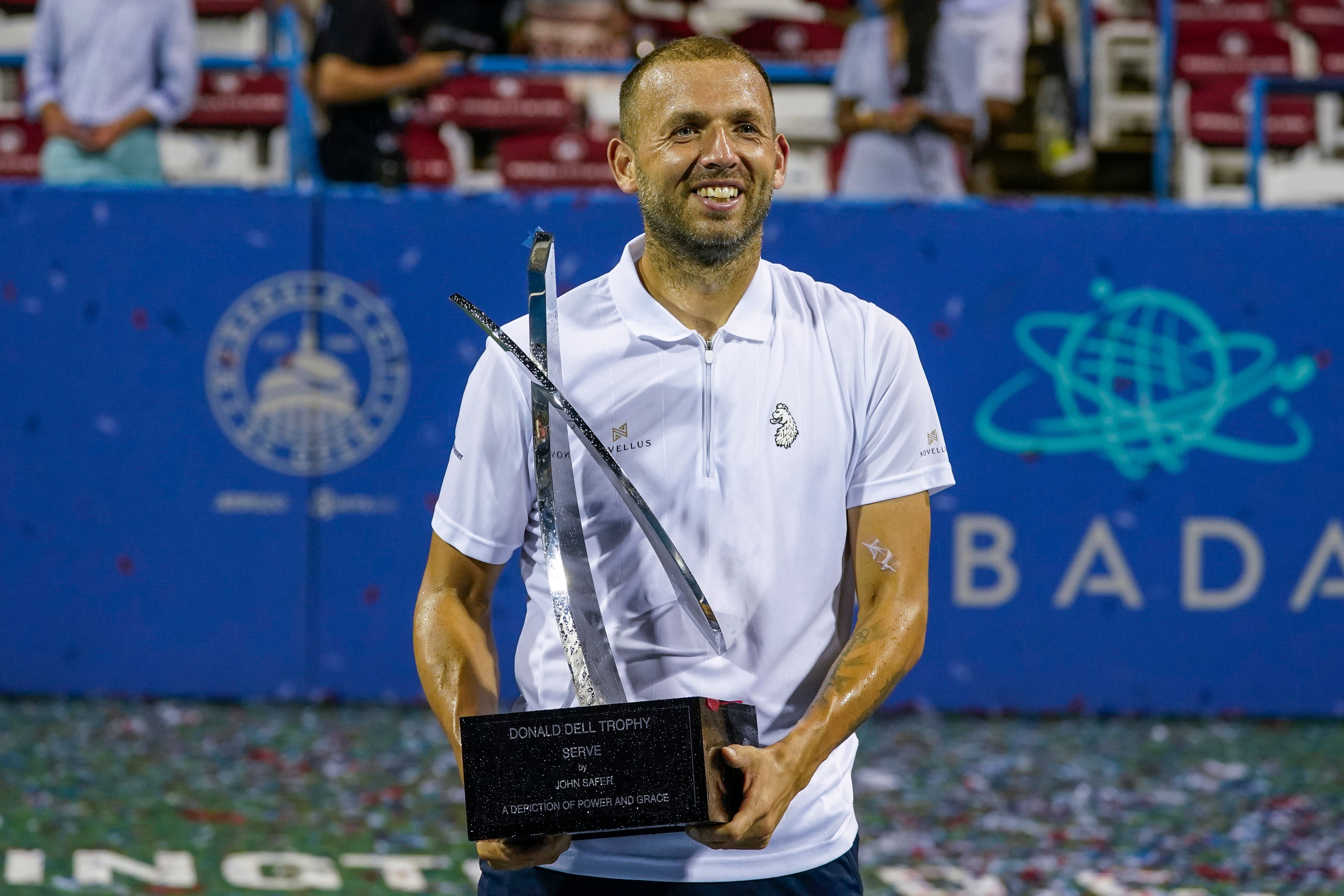 Daniel Evans, of Britain, holds the trophy after defeating Tallon Griekspoor in the men’s singles final of the Citi Open (Alex Brandon/AP)