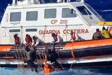 Dozens rescued from rough seas after two suspected migrant boats sink in Mediterranean