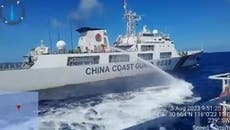 Chinese coast guard vessel appears to fire water cannon at Philippines’ ship