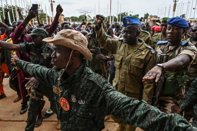 <p> Niger’s National Concil for the sefeguard of the Homeland (CNSP) Colonel-Major Amadou Abdramane (2nd R) is greeted by supporters upon his arrival at the Stade General Seyni Kountche in Niamey on 6 August 2023</p>