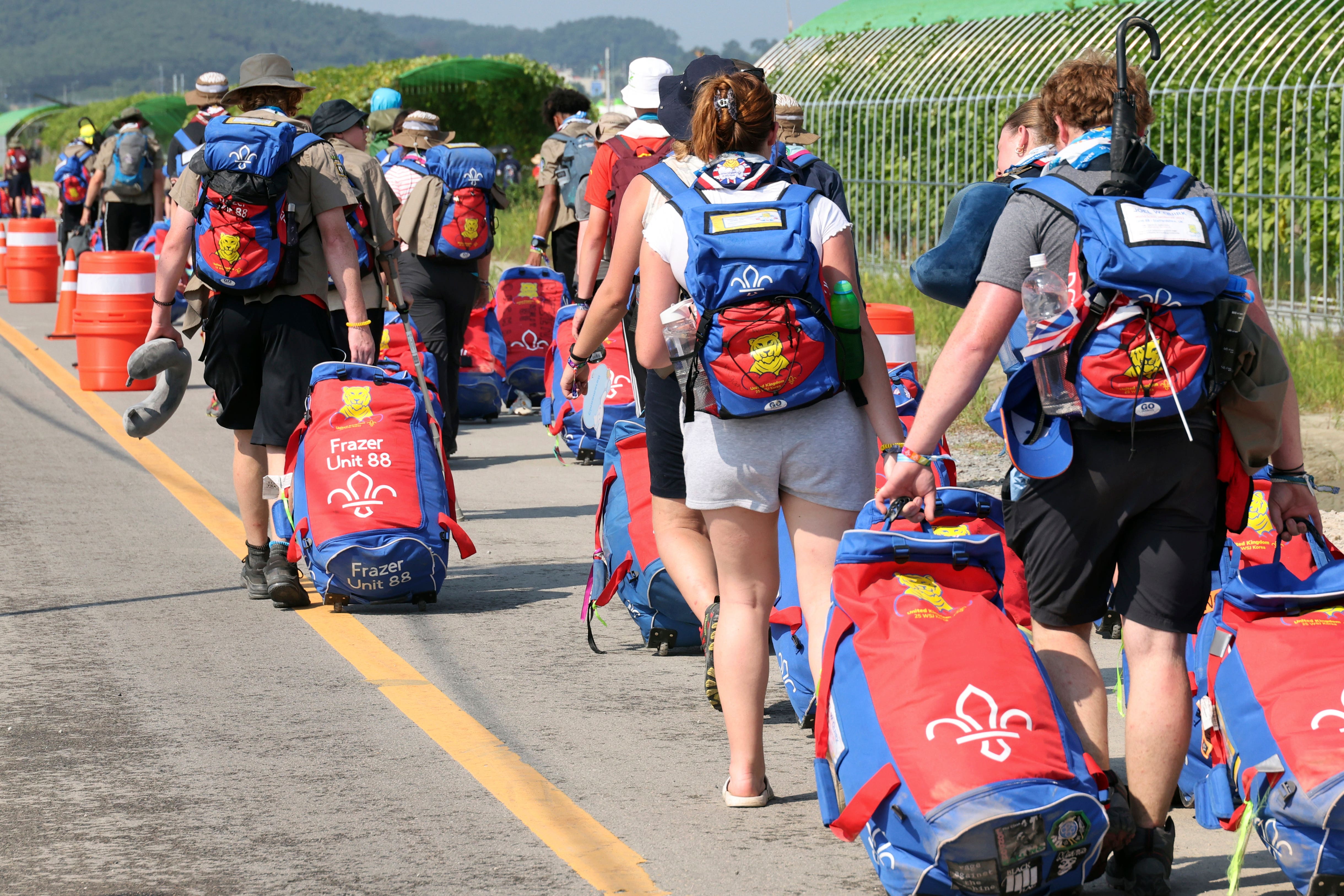 British Scouts leave the World Scout Jamboree campsite in Buan, South Korea