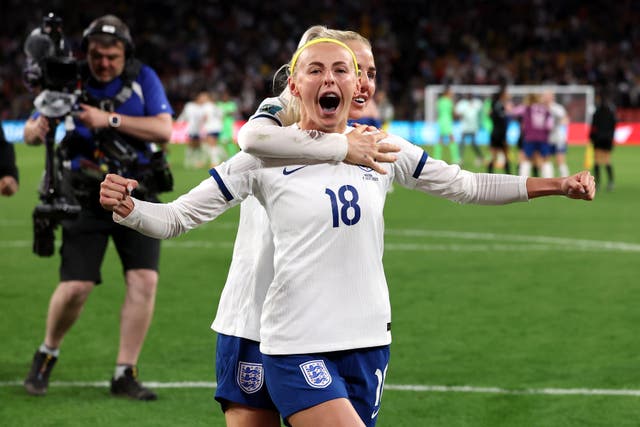 England’s Chloe Kelly and Alex Greenwood celebrate victory following a penalty shoot-out after extra time (Isabel Infantes/PA)