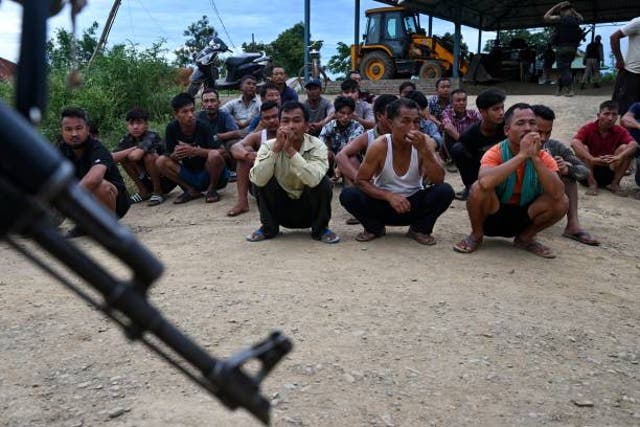 <p>In this photo taken on 22 July 2023, police detain alleged suspects of the viral sexual assault video in Pechi Awang Leikai village of the Thoubal district of north eastern state of Manipur</p>