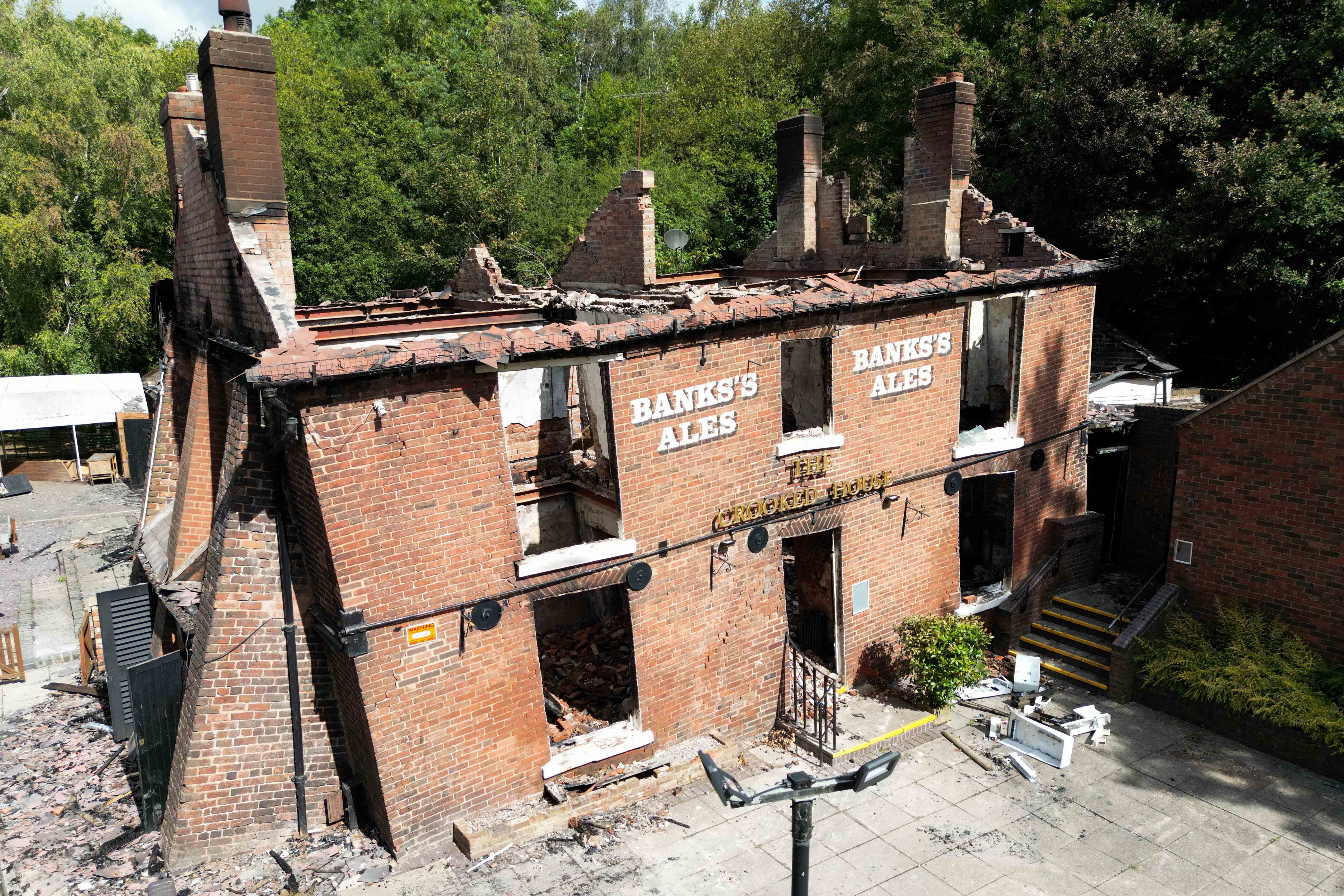 The burnt out remains of The Crooked House pub near Dudley