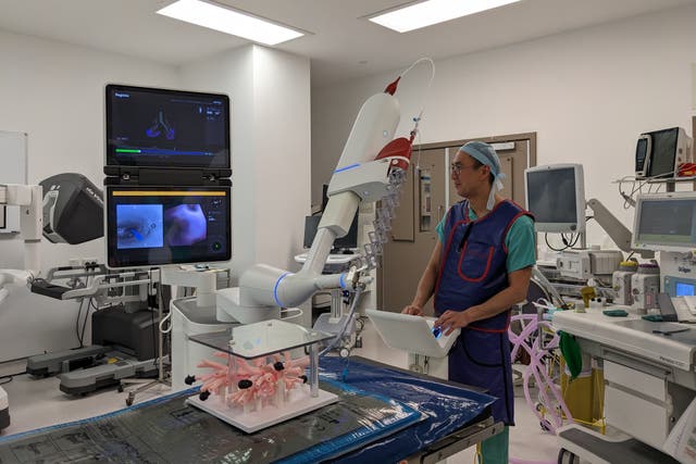 Kelvin Lau, consultant thoracic surgeon for St Bartholomew’s Hospital, using the ION system (ION/PA)