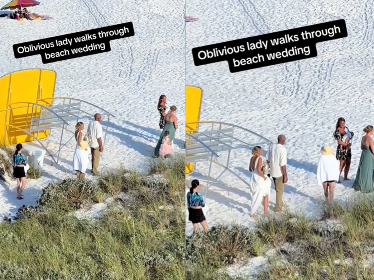 ‘Oblivious’ woman defended after walking through beach wedding