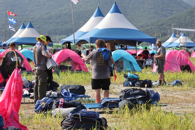 Scout members prepare to leave the World Scout Jamboree campsite in Buan, South Korea (Na Bo-bae/Yonhap via AP/PA)