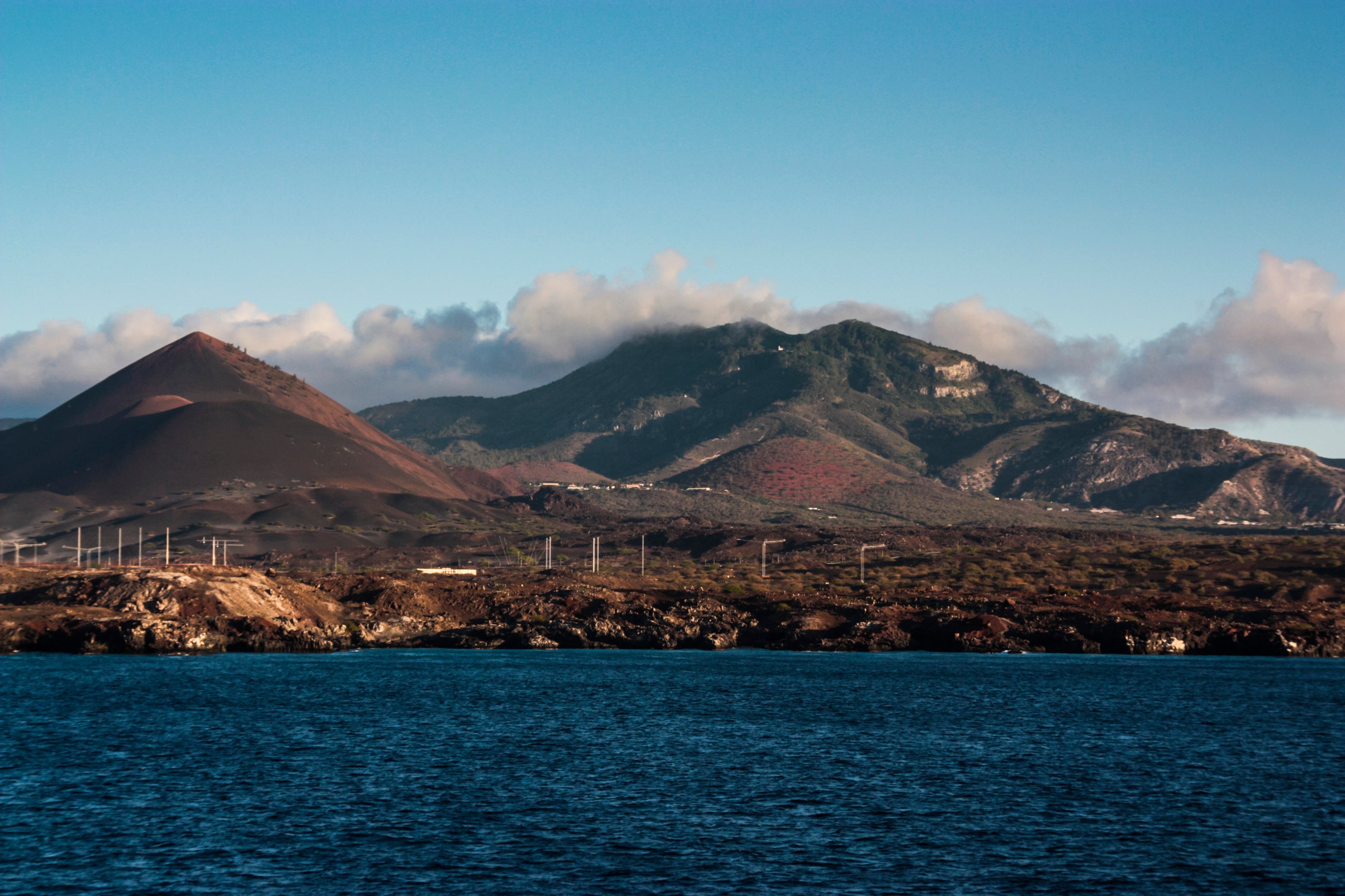 Various radar and radio masts are visible in the lava fields on Ascension Island, with Green Mountain in the background