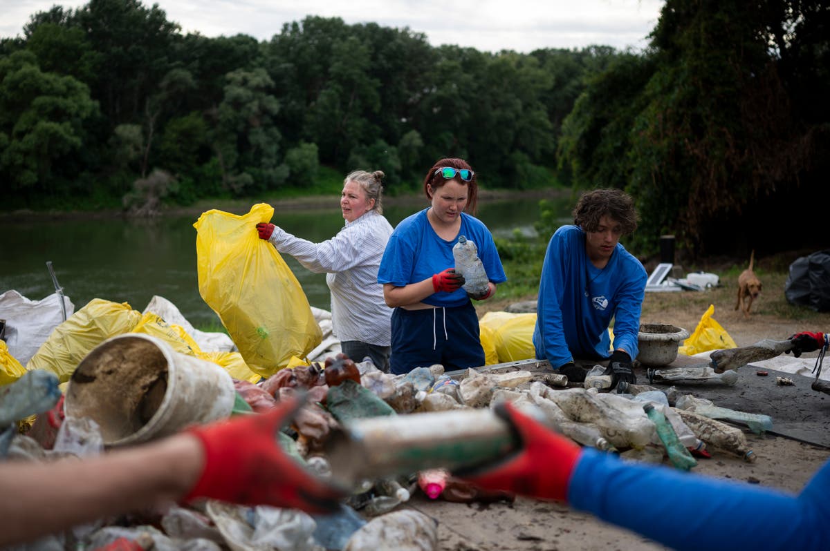 Volunteers head off plastic waste crisis by removing tons of rubbish from Hungarian river