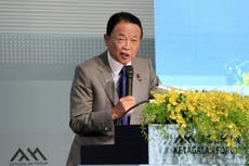Japanese political leader Taro Aso calls for peace in the Taiwan Strait as Tokyo expands defense