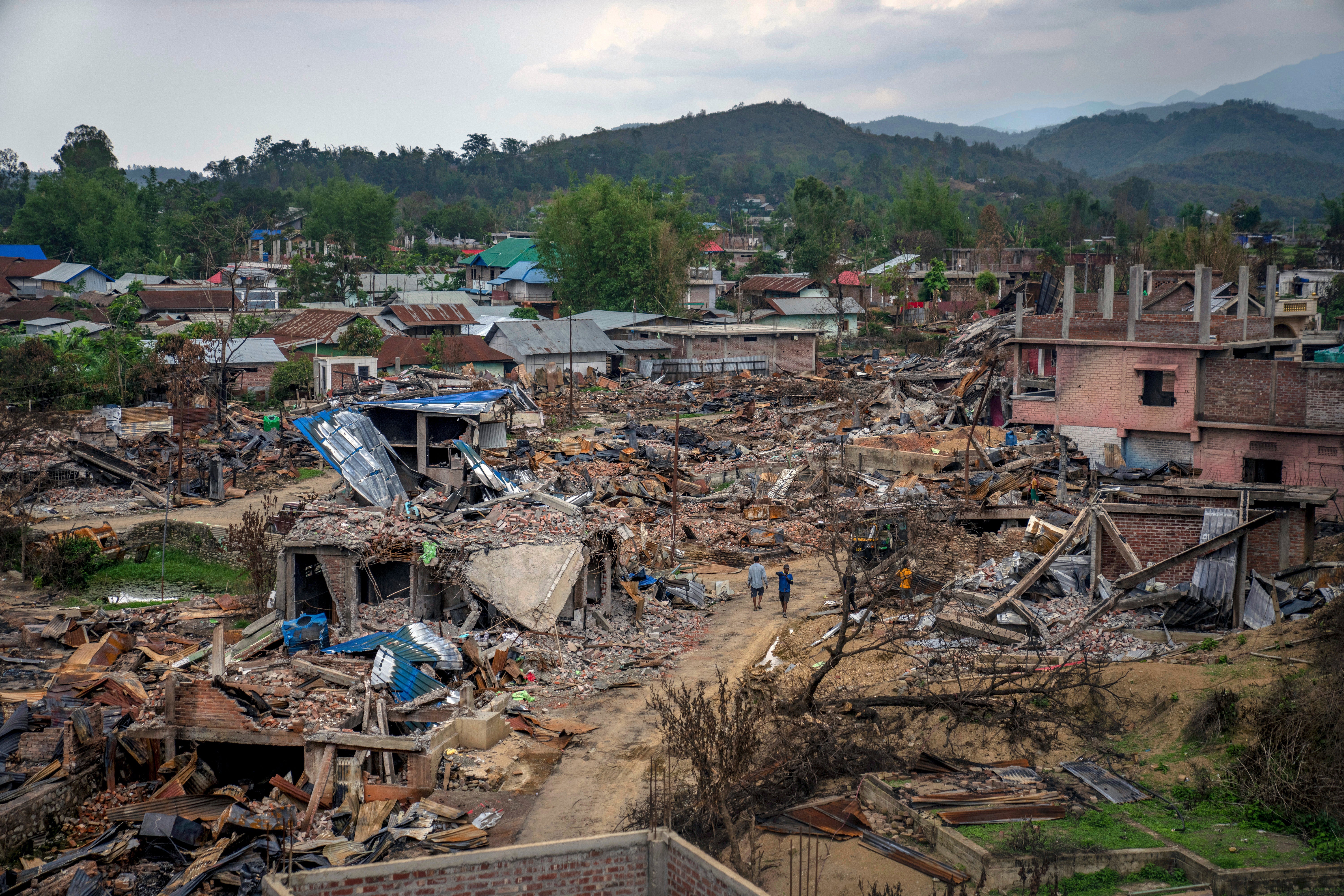 Dozens of houses lay vandalized and burnt during ethnic clashes and rioting in Sugnu, in Manipur