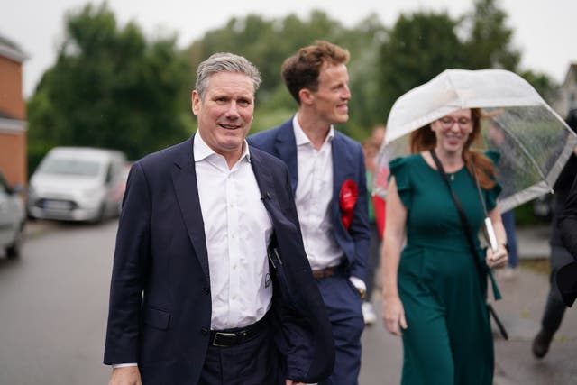 Labour leader Sir Keir Starmer and deputy leader Angela Rayner with Alistair Strathern, a would-be MP who took part in a Greenpeace protest (Jacob King/PA)