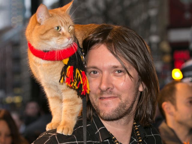 <p>James Bowen and Bob the Cat arrive for Duncan Macmillan's new play, 'People, Places & Things' at The National Theatre on March 23, 2016</p>