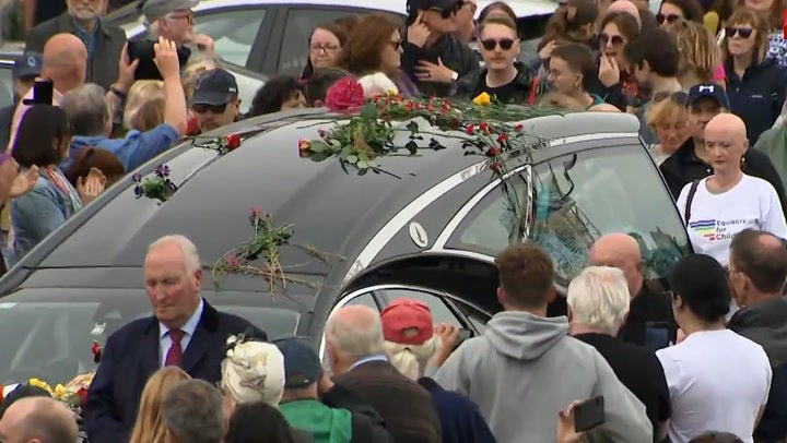 <p>Mourners gather for Sinead O'Connor's funeral procession in Bray. </p>